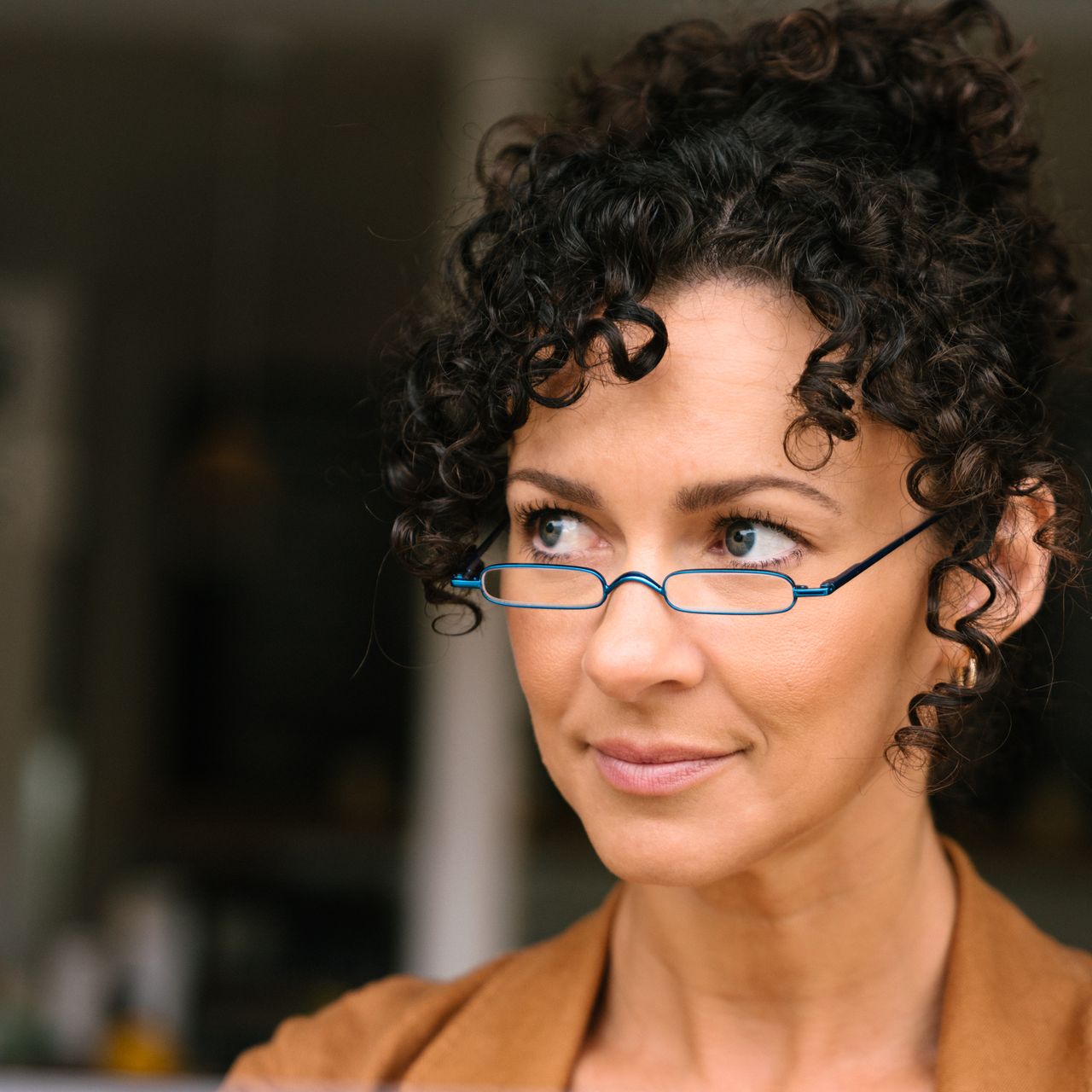 woman wearing blue mini readers